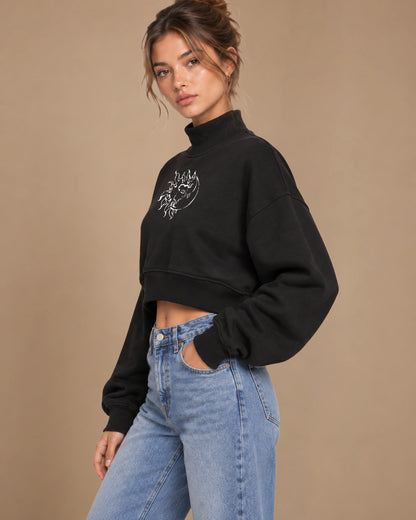 Eclipse Muse Women's Cropped Mock-Neck Sweatshirt in Black - three-quarter lifestyle view