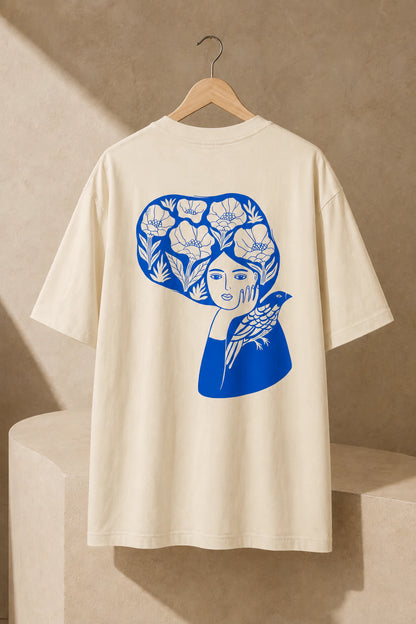 Blue Bird Reverie Oversized Unisex Tee in Mild Apricot - back artwork detail