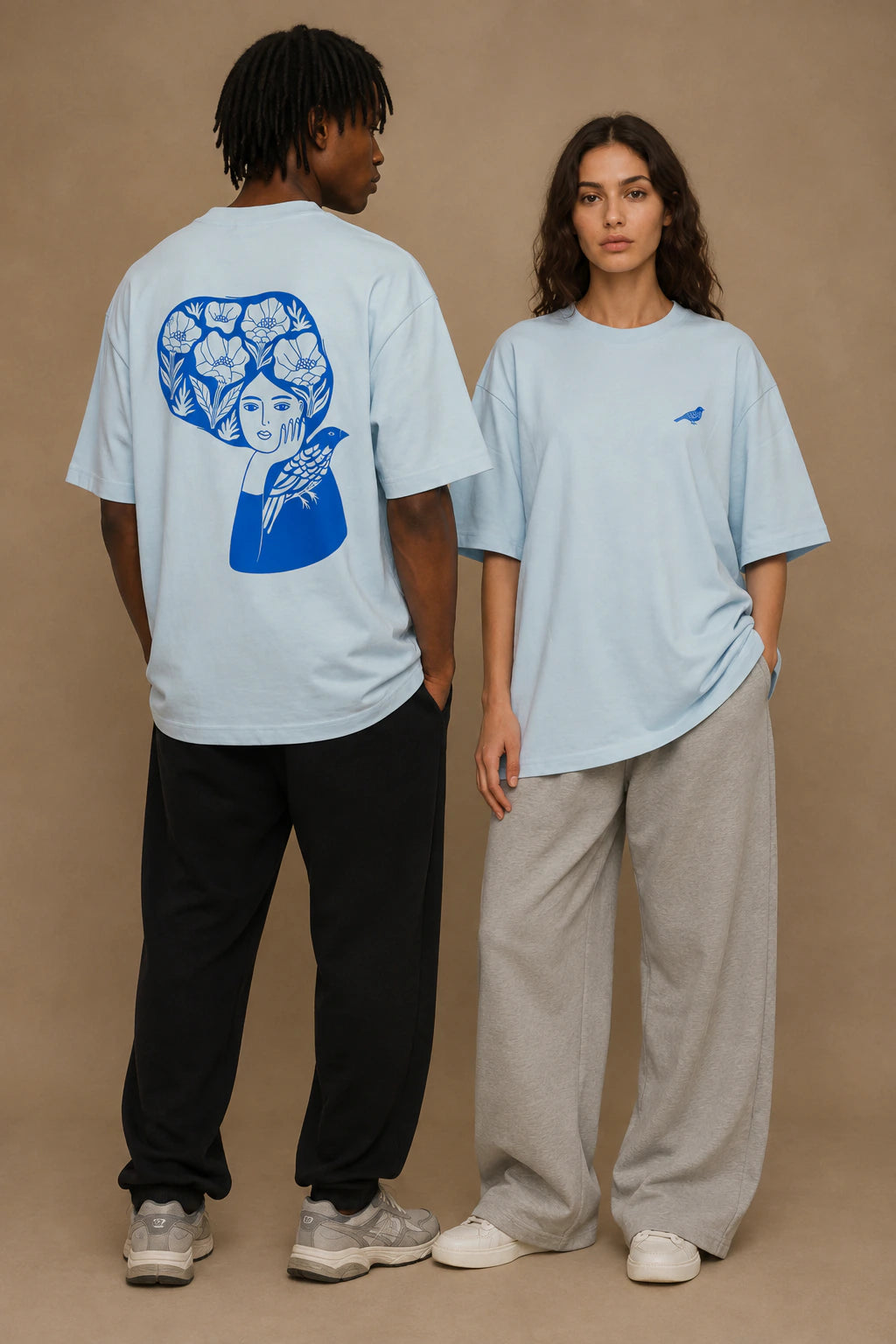 Blue Bird Reverie Oversized Unisex Tee in Sky Blue - front and back lifestyle view
